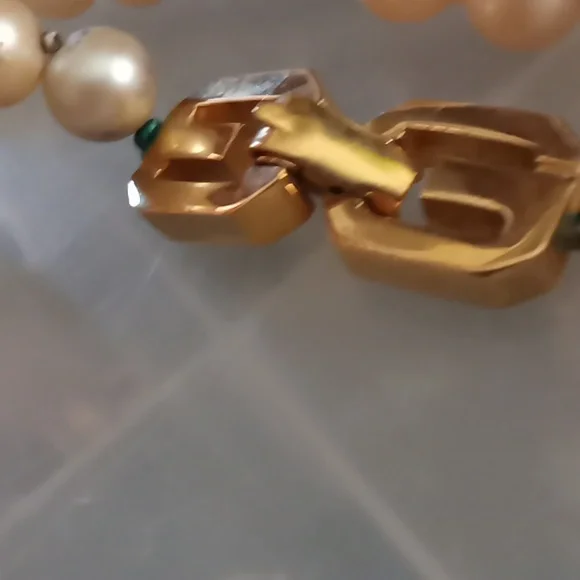 Givenchy pearl necklace with gold tone clasp.In Excellent Mint Unused Condition